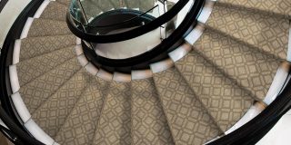 Spiral Staircase with a stylish rug