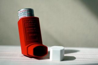 Asthma inhaler on a floor